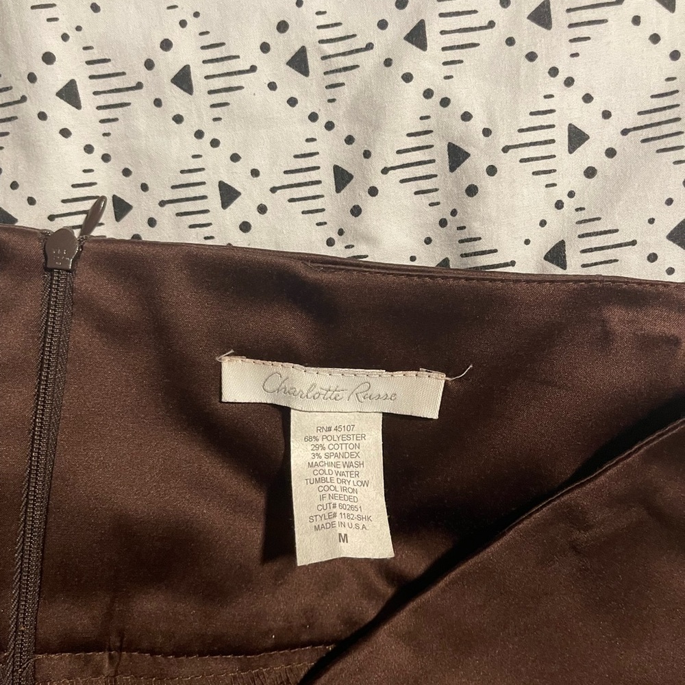 Brown skirt with a slit in the back. Size medium.